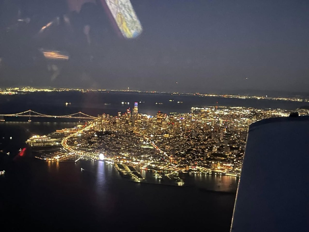 Aerial view of Sacramento at night with city lights visible