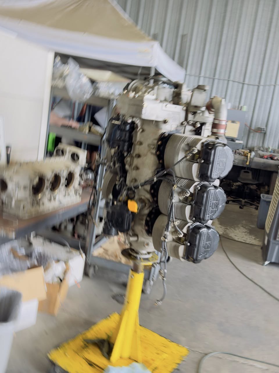 Open engine bay showing cylinders and internals during overhaul
