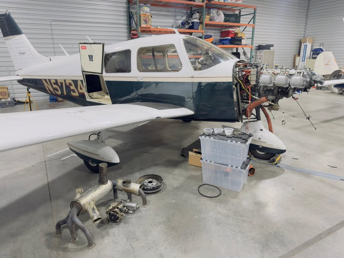 Aircraft in maintenance shop with cowl off